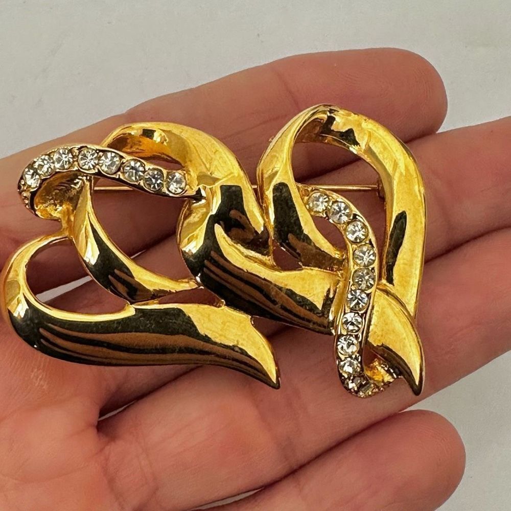 Gold tone rhinestone double heart brooch